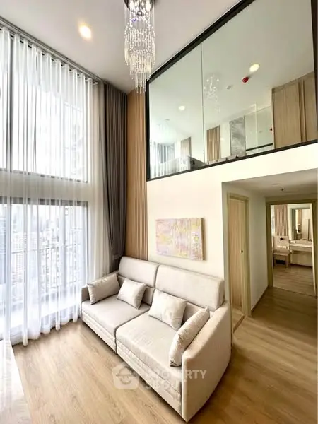Luxurious high-ceiling living room with modern decor and mezzanine in urban apartment