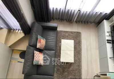 Modern living room with sleek leather sofa and stylish decor