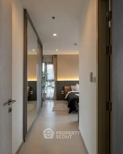 Modern bedroom with mirrored closet and cozy lighting