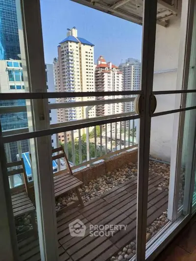 Charming balcony with city view, perfect for relaxation and enjoying urban scenery.