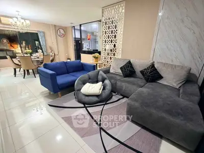 Spacious modern living room with elegant dining area and stylish decor