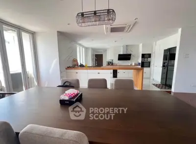 Spacious modern kitchen with open layout and elegant dining area