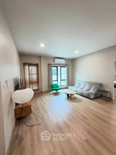 Spacious living room with modern decor and natural light