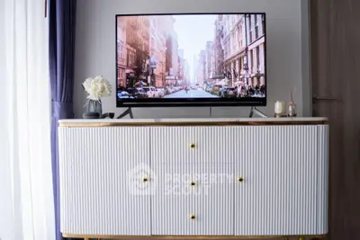 Stylish living room with modern TV stand and large flat-screen TV