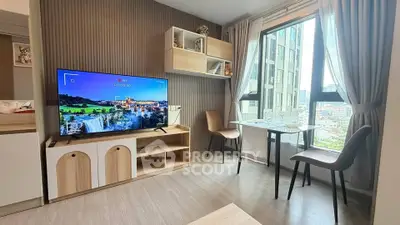 Modern living room with large window and stylish furniture in urban apartment