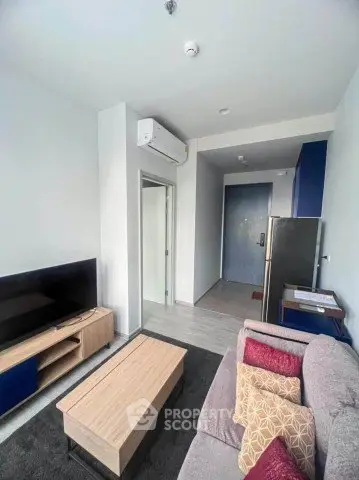 Modern living room with stylish furniture and air conditioning in a cozy apartment.