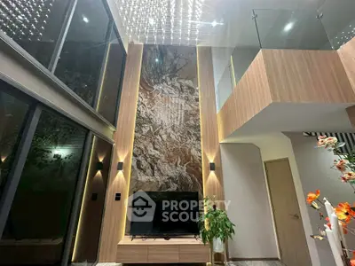 Luxurious modern living room with high ceiling and elegant decor