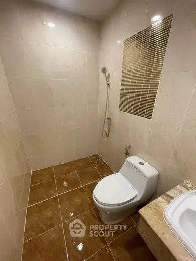 Modern bathroom with sleek tiles and contemporary fixtures