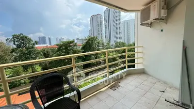 Spacious balcony with city view, perfect for relaxation and enjoying the skyline.