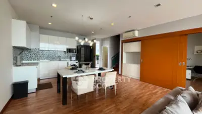 Spacious modern kitchen with open layout and stylish dining area