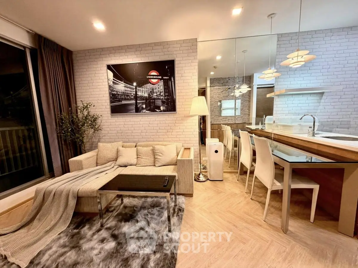 Modern living room with cozy sofa, stylish dining area, and open kitchen layout in elegant apartment.