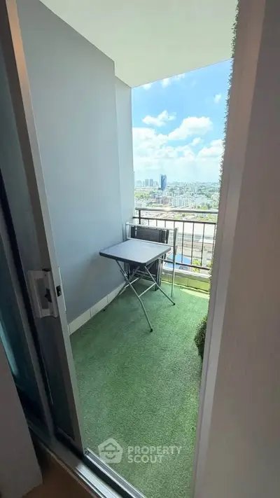 Charming balcony with city view, perfect for relaxation and enjoying the outdoors.