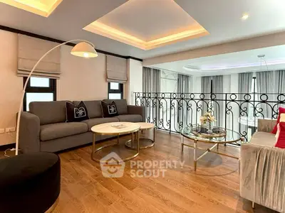 Elegant living room with modern furniture and stylish decor, featuring a cozy seating area and chic lighting.