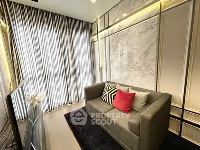 Stylish living room with modern decor and cozy sofa in elegant apartment.