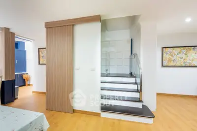 Modern interior with wooden floors and stylish staircase in a contemporary home