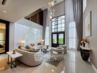 Luxurious modern living room with high ceilings and elegant decor