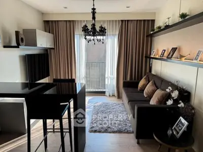 Chic modern living room with elegant chandelier and cozy sofa, perfect for urban living.