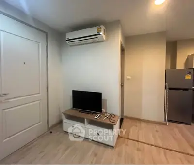 Modern living room with air conditioning and sleek furniture in a cozy apartment.