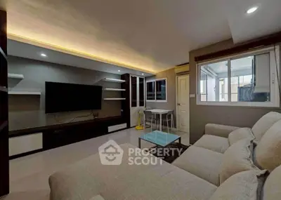 Modern living room with sleek design and cozy seating area