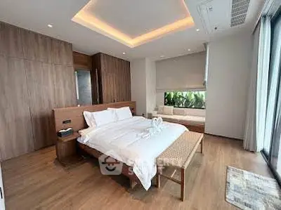 Luxurious modern bedroom with wooden accents and large window view