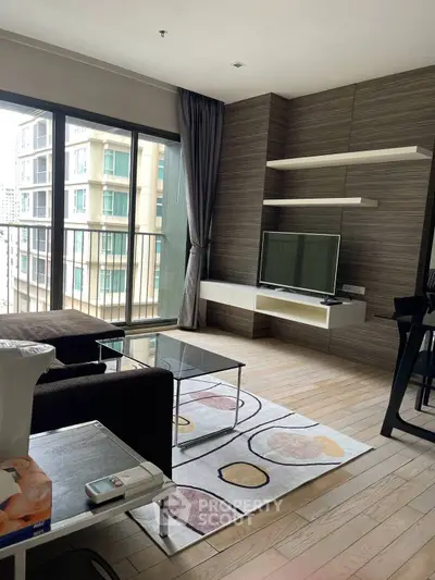 Modern living room with large windows and stylish decor in urban apartment