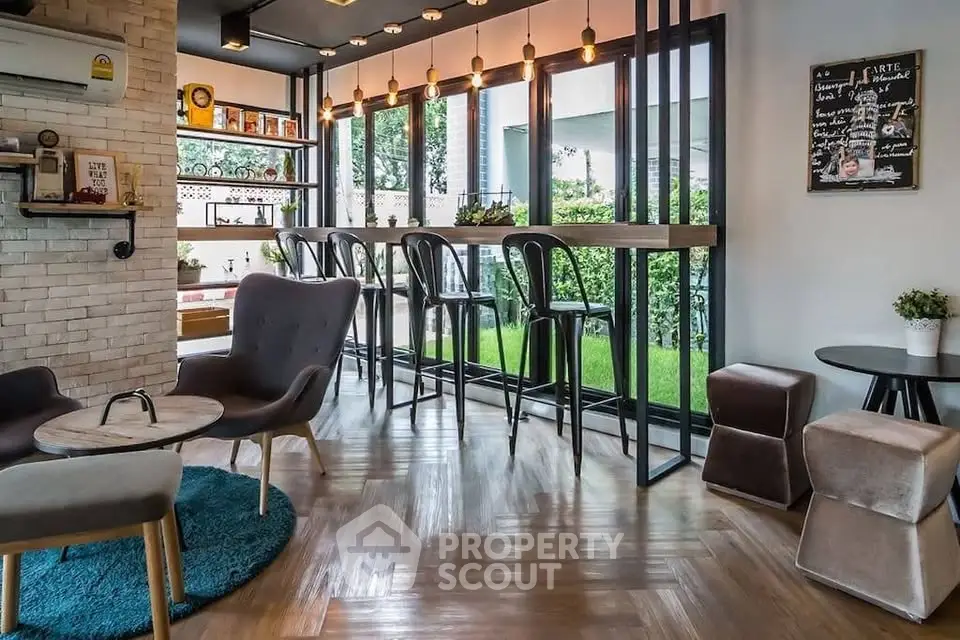 Stylish modern living room with bar seating and garden view