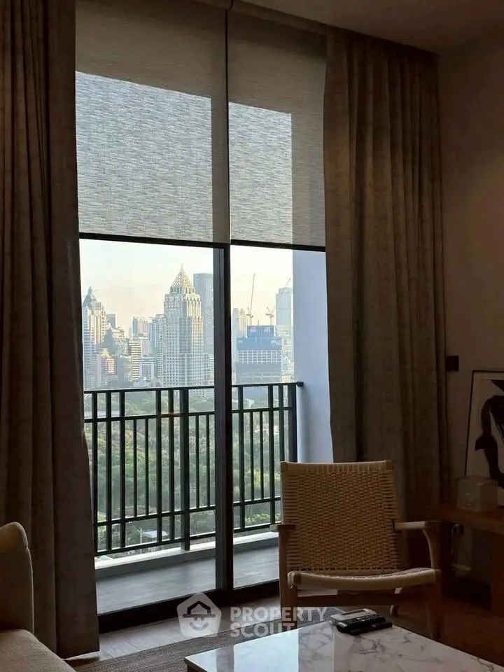 Luxurious living room with stunning city view from large balcony window.
