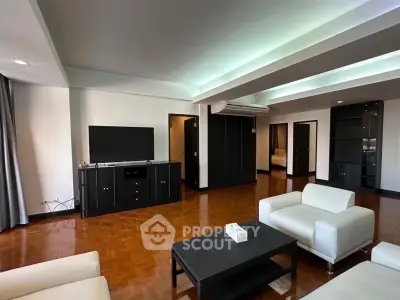 Spacious modern living room with sleek furniture and elegant wooden flooring
