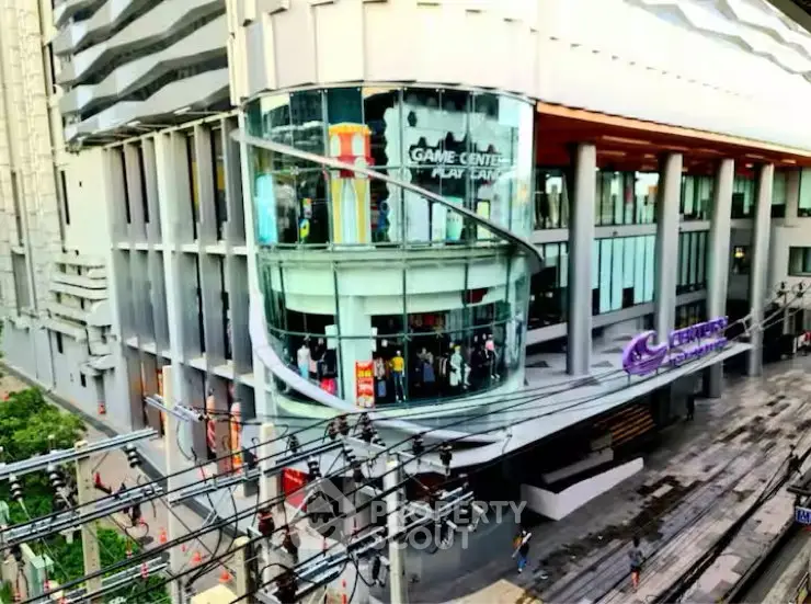 Modern commercial building with glass facade and game center entrance