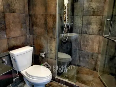 Modern bathroom with glass shower and stylish tile design