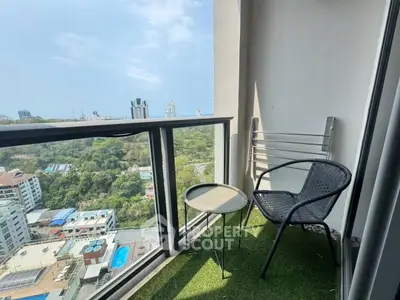 Charming balcony with stunning city view, perfect for relaxation and enjoying the outdoors.
