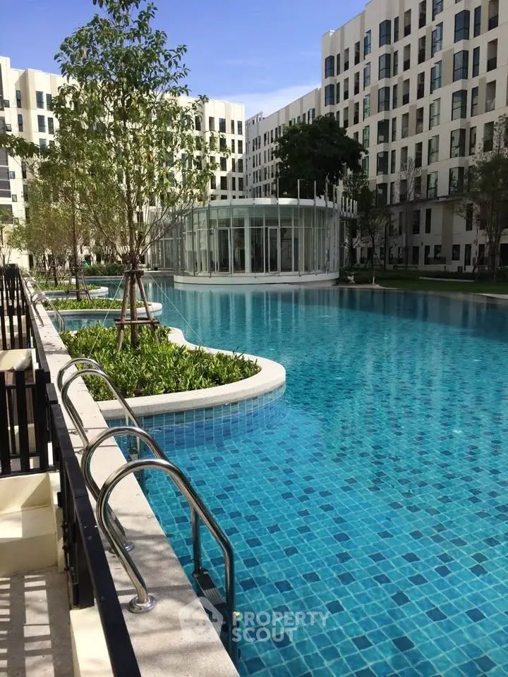 Luxurious apartment complex with stunning pool and modern architecture