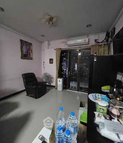 Cozy living room with modern amenities and city view