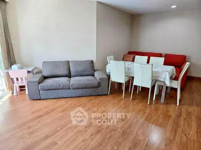 Spacious living room with elegant dining area and cozy seating arrangement.