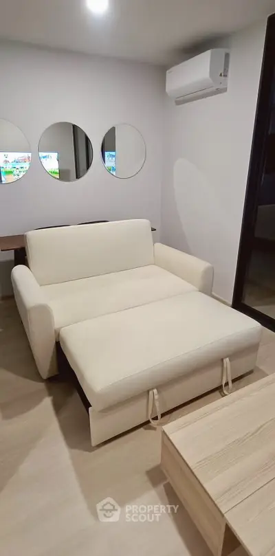 Modern living room with stylish sofa bed and minimalist decor