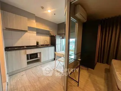 Modern compact kitchen with open layout and dining area