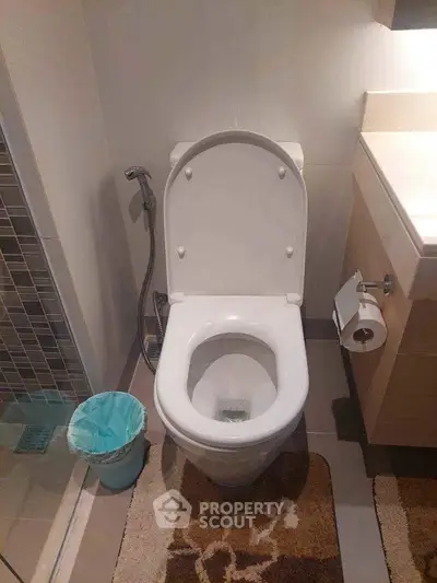 Modern bathroom with sleek toilet and stylish decor