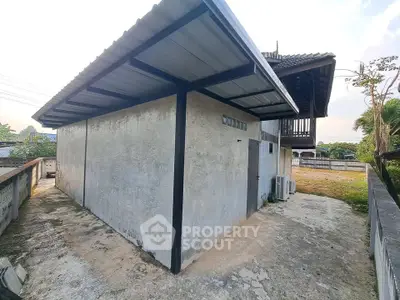 Charming rustic exterior with metal roofing and spacious outdoor area, perfect for creative renovations.