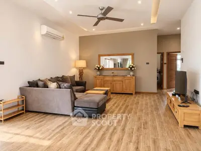 Spacious modern living room with elegant decor and wooden flooring