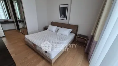 Modern bedroom with minimalist design and large mirror closet