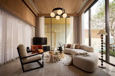 Luxurious living room with modern furniture and large windows overlooking garden.