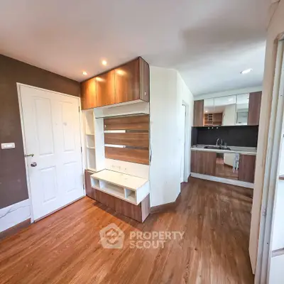 Modern apartment interior with wooden flooring and stylish kitchen design