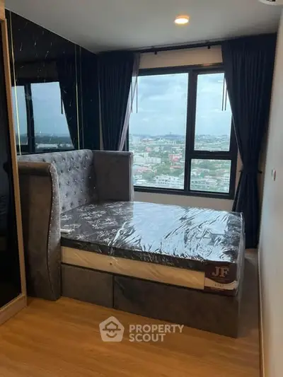 Modern bedroom with city view and stylish bed in high-rise apartment