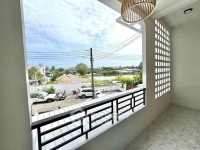 Spacious balcony with scenic view and modern railing design