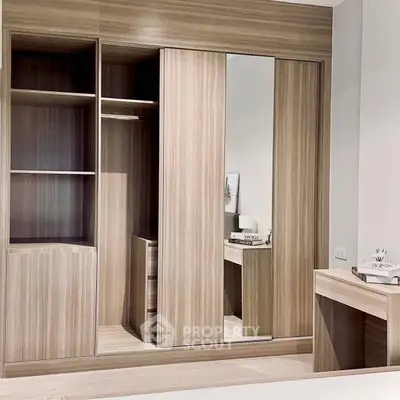 Modern bedroom with sleek wooden wardrobe and stylish decor