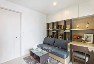 Modern living room with sleek furniture and built-in shelving, perfect for stylish urban living.