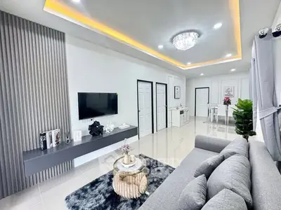 Modern living room with sleek design and elegant lighting