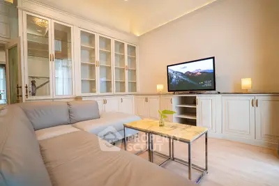 Elegant living room with cozy sectional sofa and modern TV setup