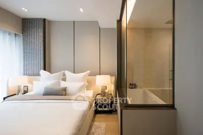 Luxurious bedroom with ensuite bathroom featuring modern design and elegant decor.
