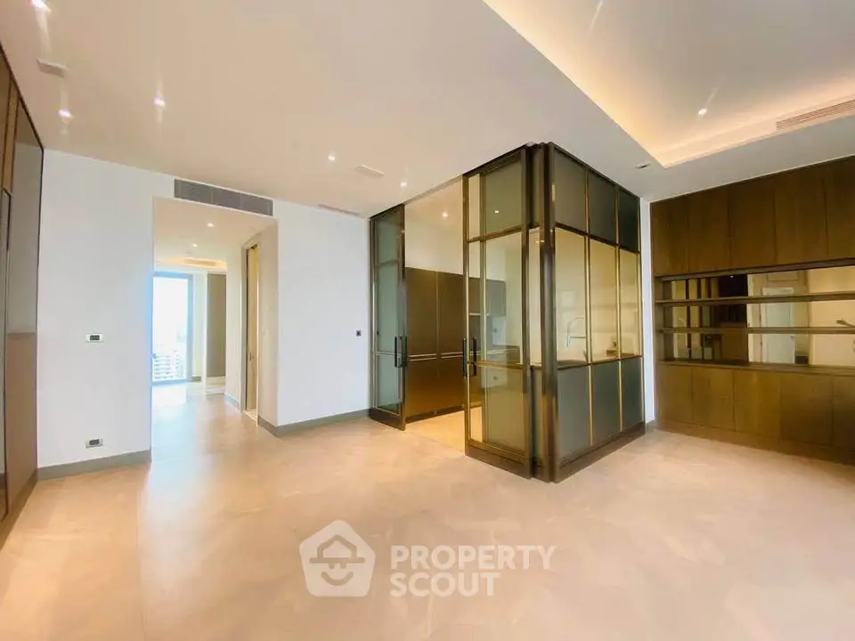 Luxurious modern living room with glass partition and elegant lighting